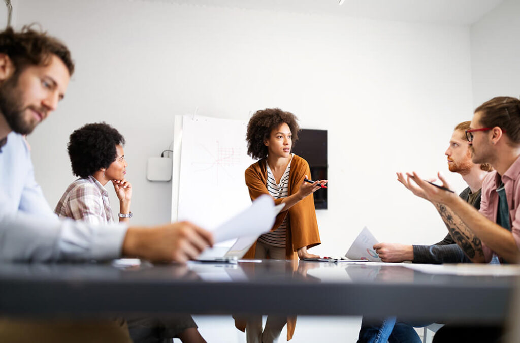 Woman presenting to a group of people